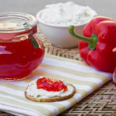 Easy to make sweet red pepper jelly that is great with crackers and cream cheese. Simple canning with instructions for how to process in hot water bath.