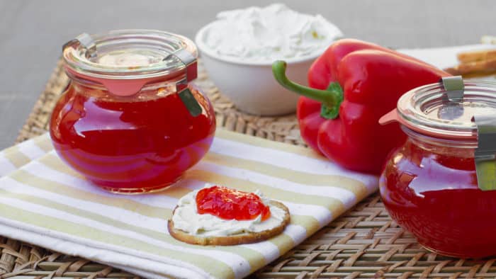 Easy to make sweet red pepper jelly that is great with crackers and cream cheese. Simple canning with instructions for how to process in hot water bath.