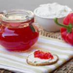 Easy to make sweet red pepper jelly that is great with crackers and cream cheese. Simple canning with instructions for how to process in hot water bath.