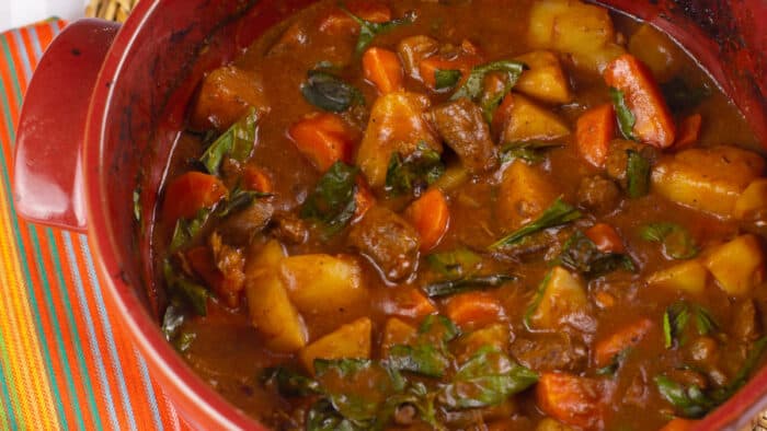 Stew in a red pot.