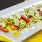 A summer salad on a white plate.