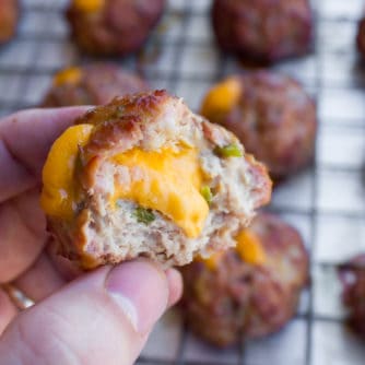 These pork meatballs are stuffed with cheddar cheese and jalapeno peppers and smoked in a Bradley smoker. Delicious, cheesy and a little spicy too!