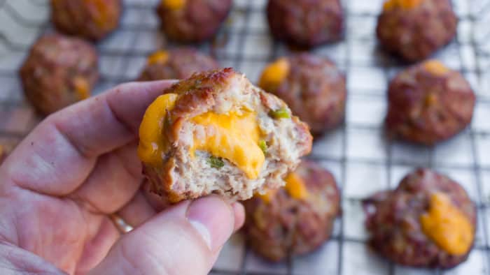 These pork meatballs are stuffed with cheddar cheese and jalapeno peppers and smoked in a Bradley smoker. Delicious, cheesy and a little spicy too!