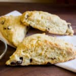 These raisin scones are buttery and flaky baked biscuits. Super easy to make and bake. The raisins can be substituted with dried cranberries or some fresh blueberries, strawberries etc.