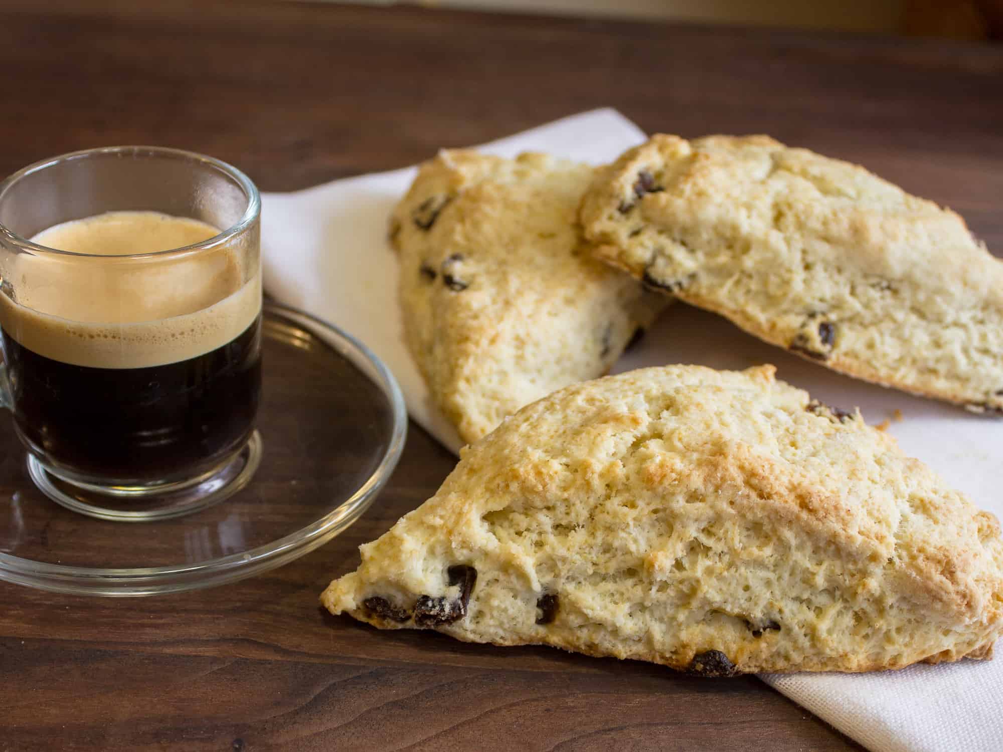 These raisin scones are buttery and flaky baked biscuits. Super easy to make and bake. The raisins can be substituted with dried cranberries or some fresh blueberries, strawberries etc.