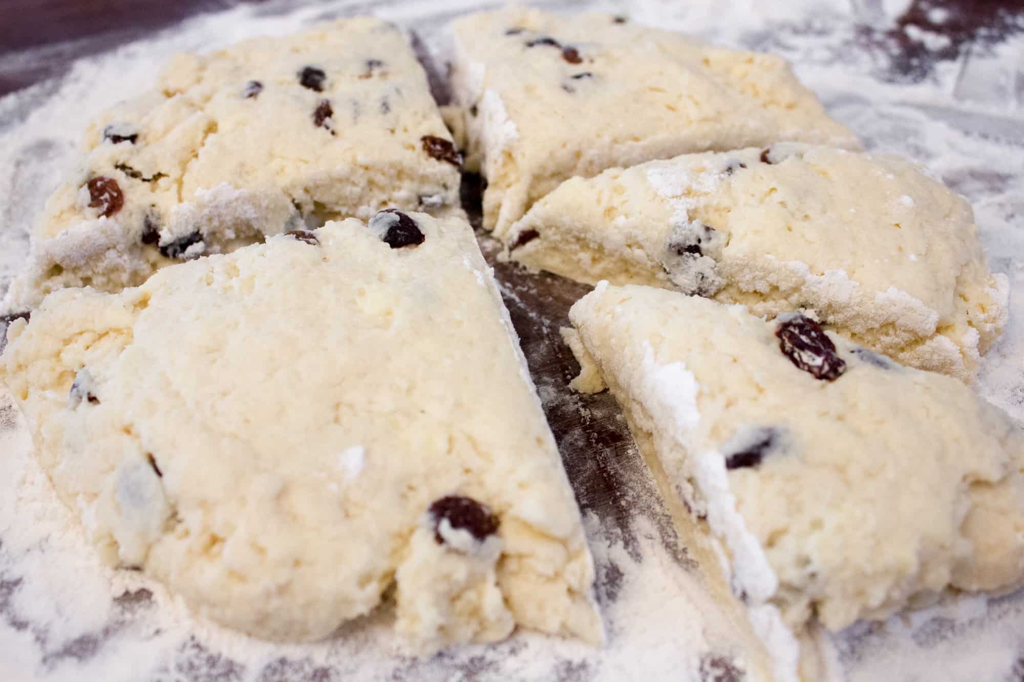 These raisin scones are buttery and flaky baked biscuits. Super easy to make and bake. The raisins can be substituted with dried cranberries or some fresh blueberries, strawberries etc.