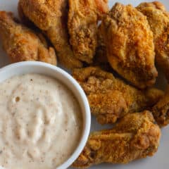 Crispy deep fried chicken wings tossed in a homemade spicy Cajun spice rub seasoning blend. Served with some Creole Buttermilk Ranch dip.
