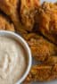 Crispy deep fried chicken wings tossed in a homemade spicy Cajun spice rub seasoning blend. Served with some Creole Buttermilk Ranch dip.