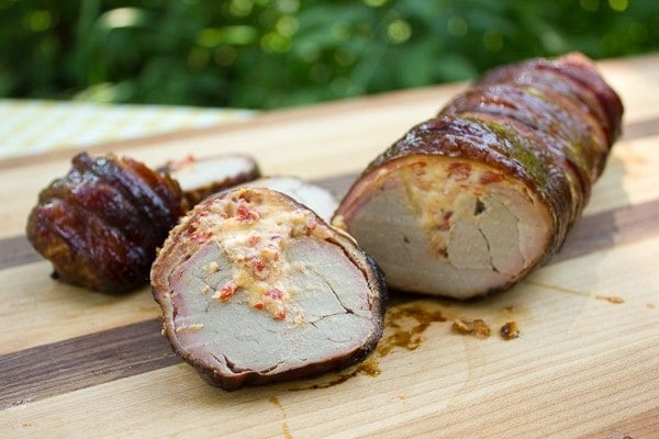 Bacon Wrapped Smoked Pork Tenderloin Stuffed with Roasted Red Peppers and Cheese close