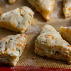 Fresh baked cheddar jalapeno scones are biscuits that have lots of cheddar cheese and minced pickled jalapeño peppers. Best served warm with soup or chili!