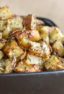 A bowl of oven roasted hash brown potatoes.