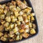 Simple instructions to make roasted potatoes with a herb and garlic seasoning. Crispy on the outside but soft and fluffy on the inside, these potatoes are similar to french fries or hash browns.