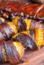 Smoked Corn on the Cob Wrapped in Bacon