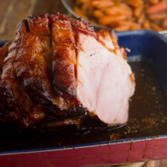 A baked ham in a large dish.