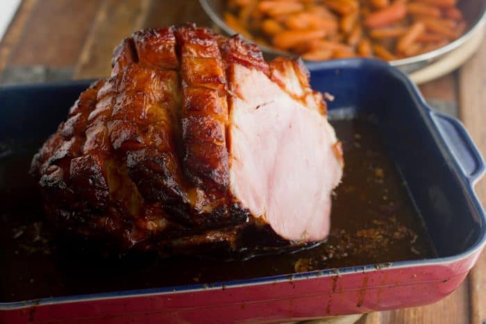 A baked ham in a large dish.