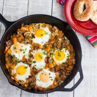 An overhead image of baked eggs in a cast iron skillet.