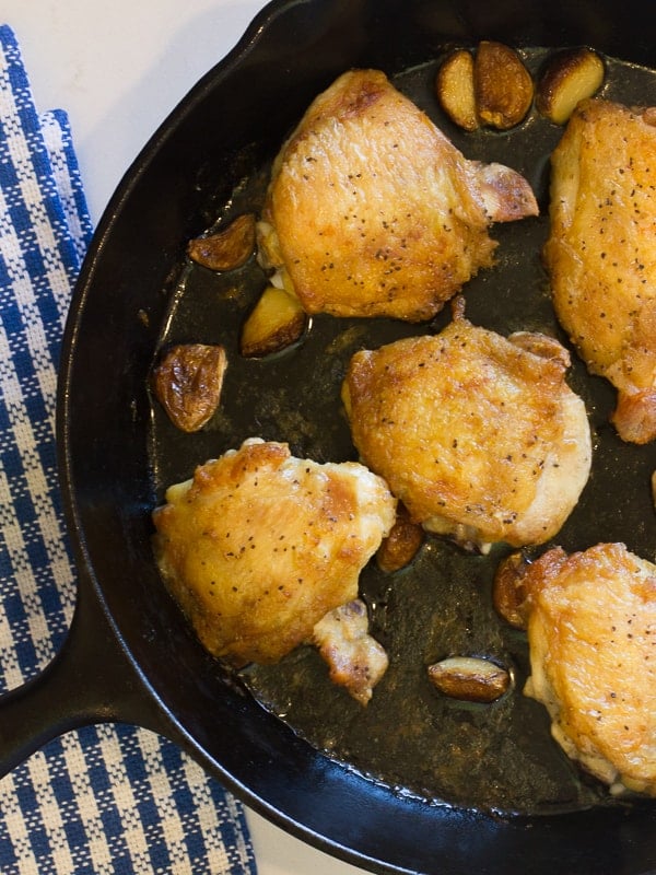 The ultimate recipe for cooking chicken thighs in a cast iron skillet. Start on the stovetop and finish in the oven.