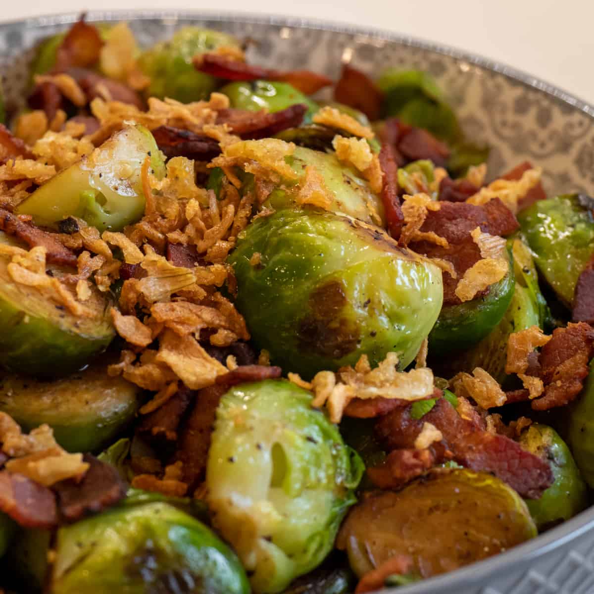 A close up picture of fried Brussel's sprouts with bacon.
