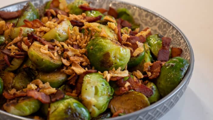 A bowl of cooked Brussel's sprouts with bacon