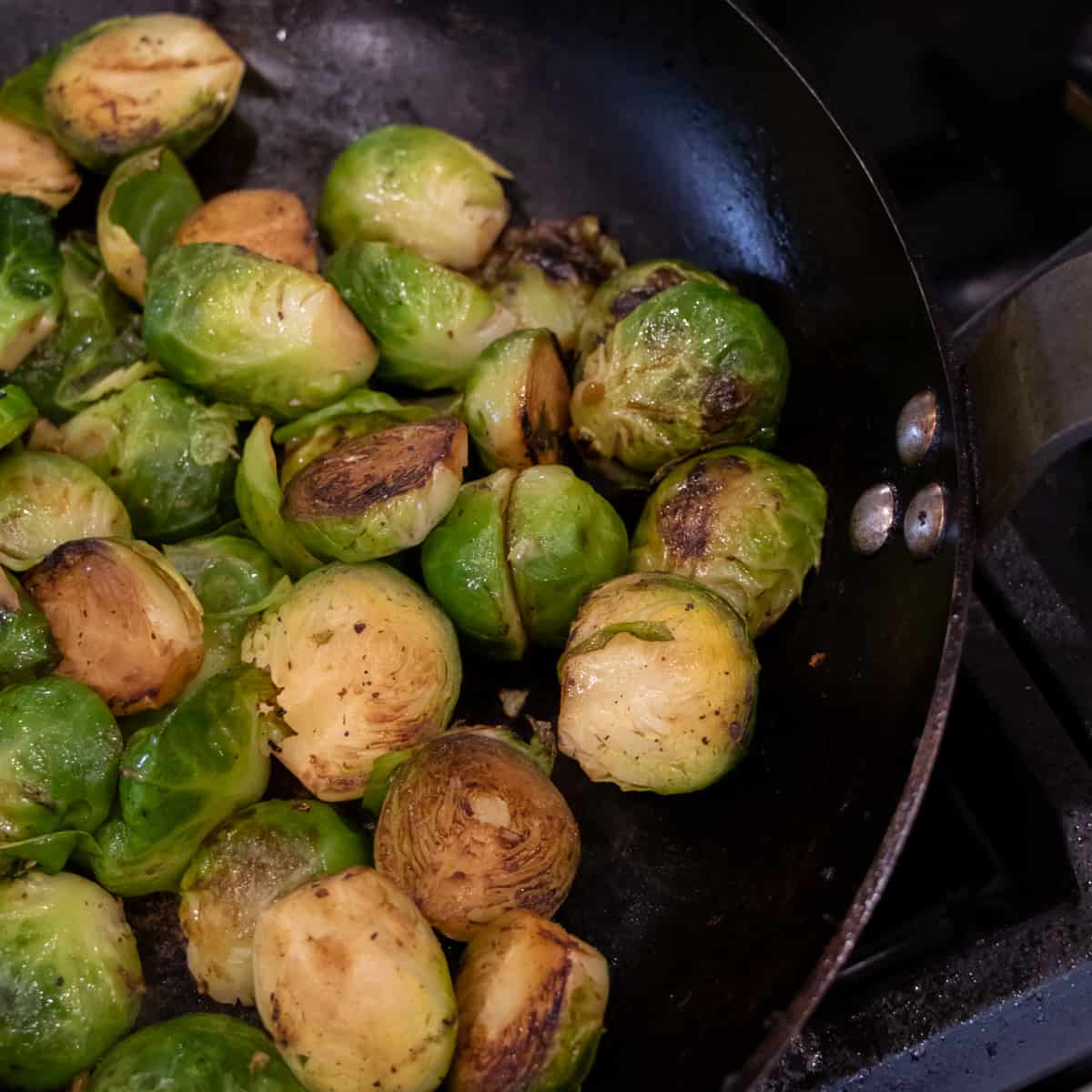 Sautéed Brussel's sprouts in a frying pan.