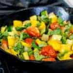Fresh sautéed zucchini, onion, yellow pepper and campari tomatoes with basil and white wine. Recipe has bright flavours and a perfect side for chicken, fish and pork. Make in less than 30 minutes.