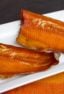 Wood smoked rainbow trout that has been marinated in a sweet wet brine. Simple instructions and recipe for how to smoke a rainbow trout.