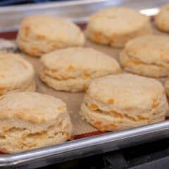 Simple recipe for how to bake cheddar cheese biscuits that are buttery, flakey and simple to make in the oven. Fresh baked and similar to Red Lobster's Cheddar Bay biscuits.