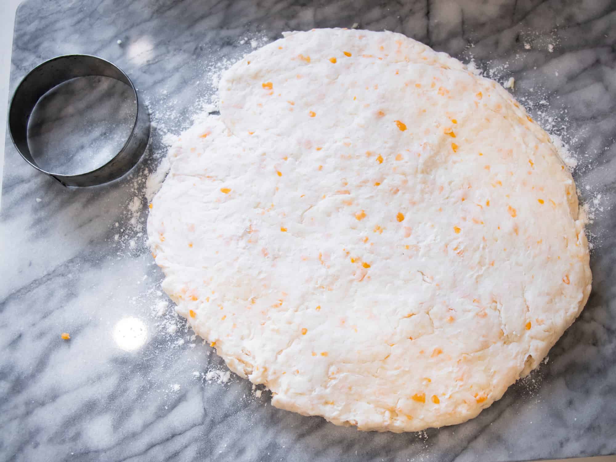 Flatten the dough on a floured surface