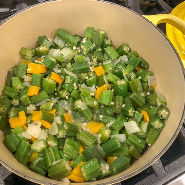 Classic stewed okra and tomatoes with onions, peppers, celery and creole seasoning. A great side dish recipe for any southern or Cajun meal!