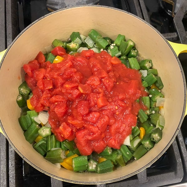 Classic stewed okra and tomatoes with onions, peppers, celery and creole seasoning. A great side dish recipe for any southern or Cajun meal!