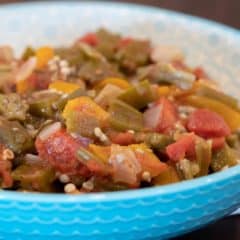 Simple recipe for how to make stewed okra southern side dish. Creole and cajun style with tomatoes, onions and peppers.