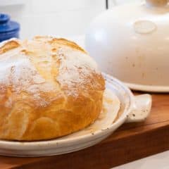 Simple to make rustic artisan bread recipe that can be baked in a clay bread cloche, dutch oven, or baking sheet.