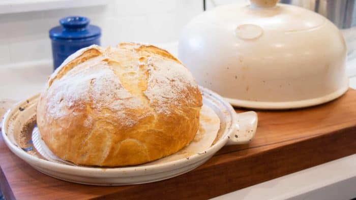 Simple to make rustic artisan bread recipe that can be baked in a clay bread cloche, dutch oven, or baking sheet.