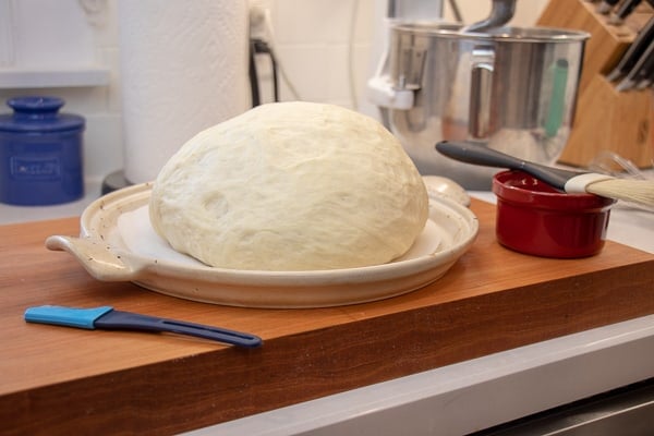 Simple to make rustic artisan bread recipe that can be baked in a clay bread cloche, dutch oven, or baking sheet.