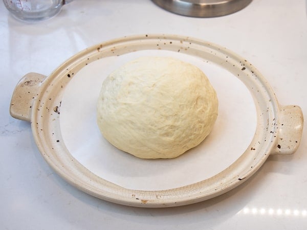 Simple to make rustic artisan bread recipe that can be baked in a clay bread cloche, dutch oven, or baking sheet.