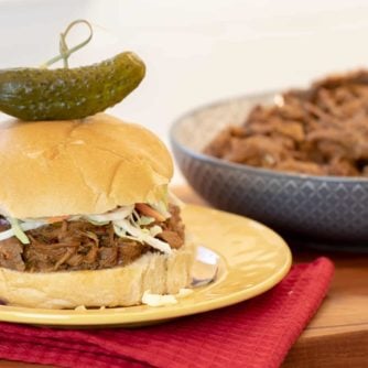 How to make pulled pork in a pressure cooker like an Instant Pot. Simple recipe that uses a pork roast, like a shoulder, blade or picnic, can of pop, BBQ sauce, onion, peppers, celery and mushrooms for a pulled pork full of flavour!