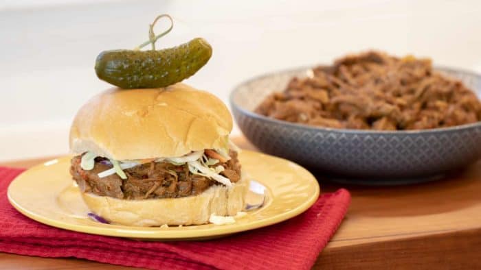 How to make pulled pork in a pressure cooker like an Instant Pot. Simple recipe that uses a pork roast, like a shoulder, blade or picnic, can of pop, BBQ sauce, onion, peppers, celery and mushrooms for a pulled pork full of flavour!