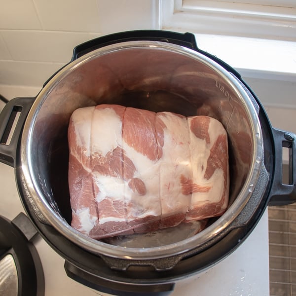 How to make pulled pork in a pressure cooker like an Instant Pot. Simple recipe that uses a pork roast, like a shoulder, blade or picnic, can of pop, BBQ sauce, onion, peppers, celery and mushrooms for a pulled pork full of flavour!