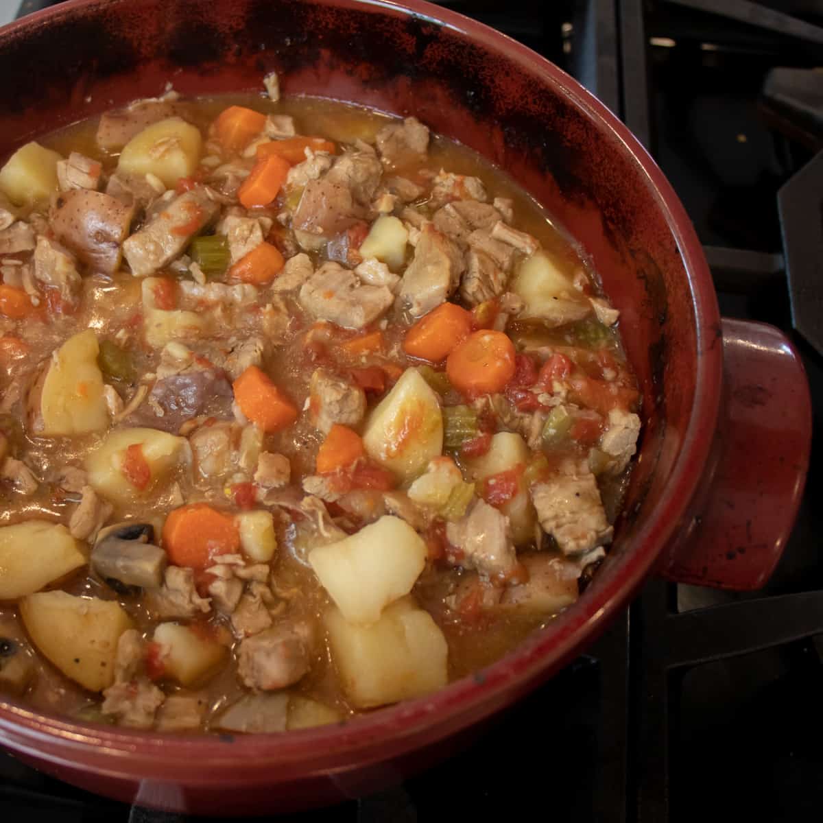 Cooked stew in a large dutch oven.
