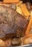 Easy recipe and instructions for how to cook a sirloin tip roast in the oven so that it is well done but also tender, juicy and delicious. Vegetables include carrots, potatoes, onions, mushrooms, celery and garlic.