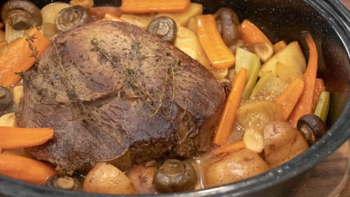 Easy recipe and instructions for how to cook a sirloin tip roast in the oven so that it is well done but also tender, juicy and delicious. Vegetables include carrots, potatoes, onions, mushrooms, celery and garlic.