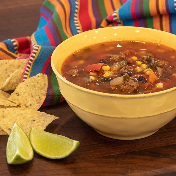 Easy to make recipe for soup full of Mexican inspired flavours. Ground beef, tomatoes, black beans, corn chili powder and more.
