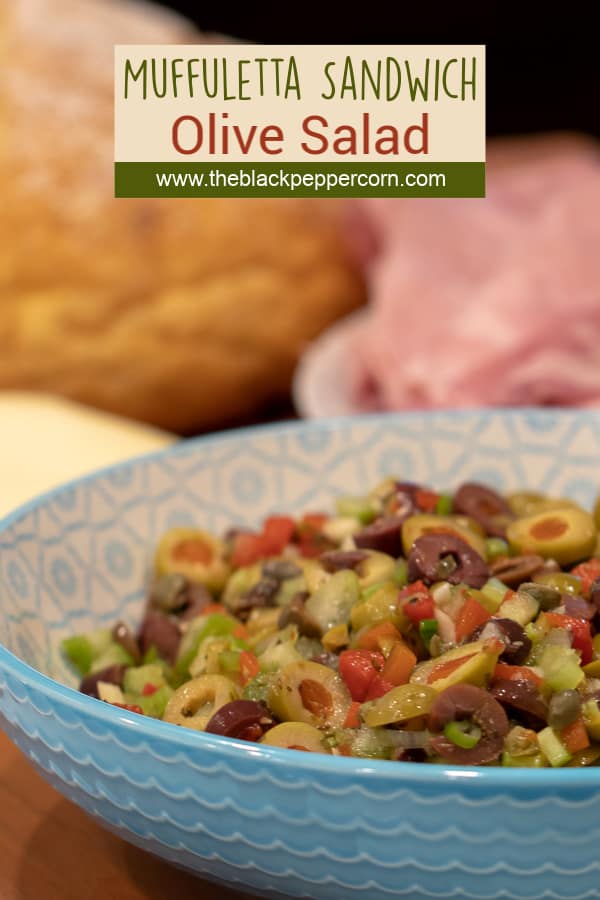 Olive salad spread recipe for muffuletta sandwich made with green and kalamata olives as well as roasted red peppers, capers, celery and green onions.