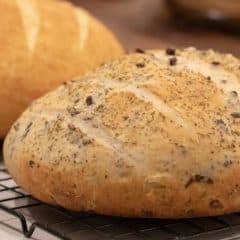 Easy to make rustic olive bread with oregano. Crusty round bread loaf with kalamata olives.