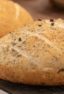 Easy to make rustic olive bread with oregano. Crusty round bread loaf with kalamata olives.