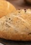 Easy to make rustic olive bread with oregano. Crusty round bread loaf with kalamata olives.