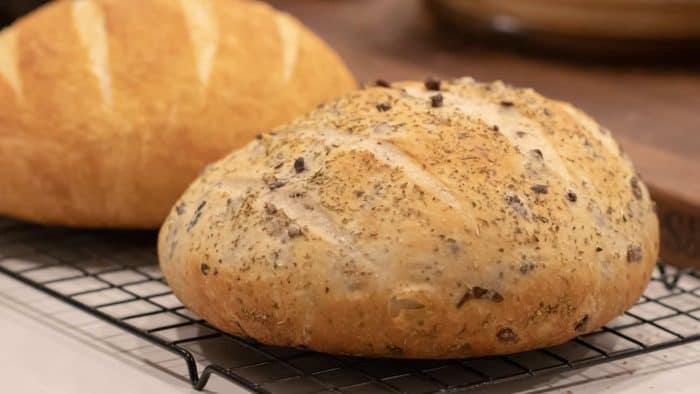Easy to make rustic olive bread with oregano. Crusty round bread loaf with kalamata olives.