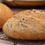 Easy to make rustic olive bread with oregano. Crusty round bread loaf with kalamata olives. How to bake recipe for a delicious fresh loaf of bread.