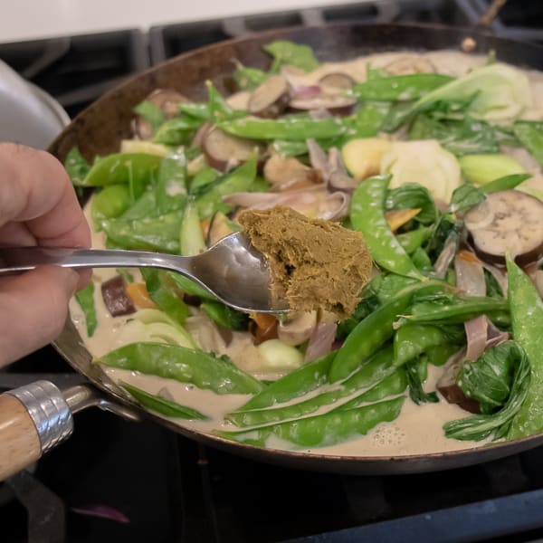 Easy Thai Vegetable Curry with green curry paste and coconut milk. Made with Asian eggplant, baby bok choy, snow peas, mushrooms, zucchini, pepper and more! Serve on jasmine rice. 