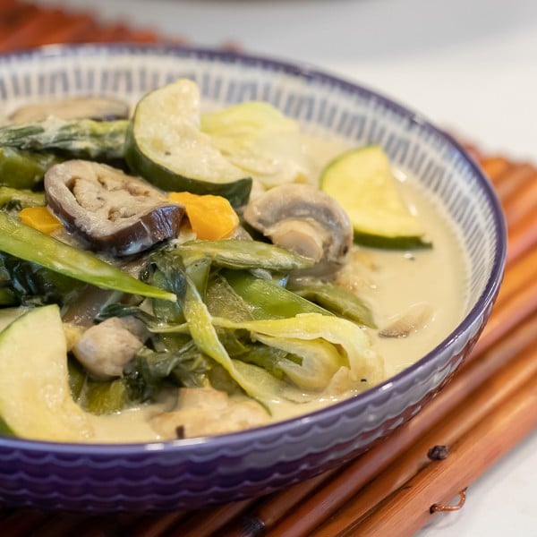 Easy Thai Vegetable Curry with green curry paste and coconut milk. Made with Asian eggplant, baby bok choy, snow peas, mushrooms, zucchini, pepper and more! Serve on jasmine rice. 